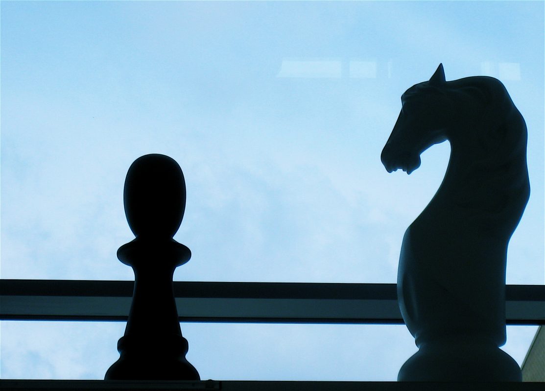 Close-up of two chess figures.